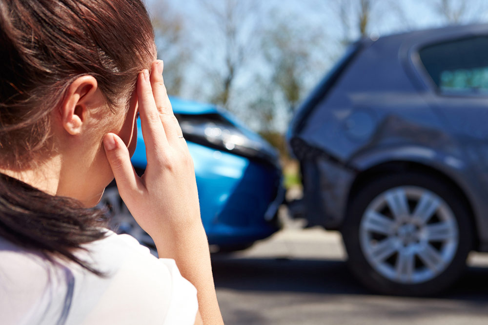 woman enduring headache after an auto accident